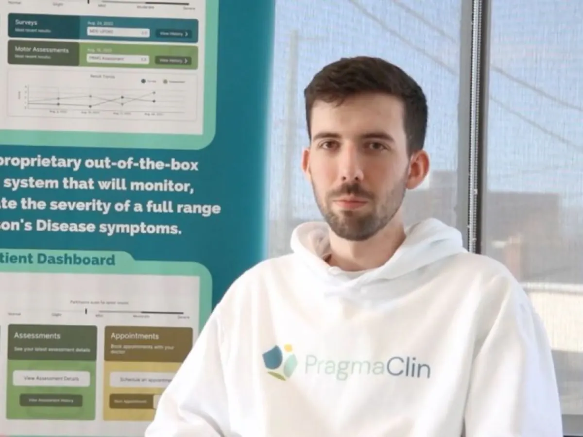 Eric Cahill in a PragmaClin hoodie