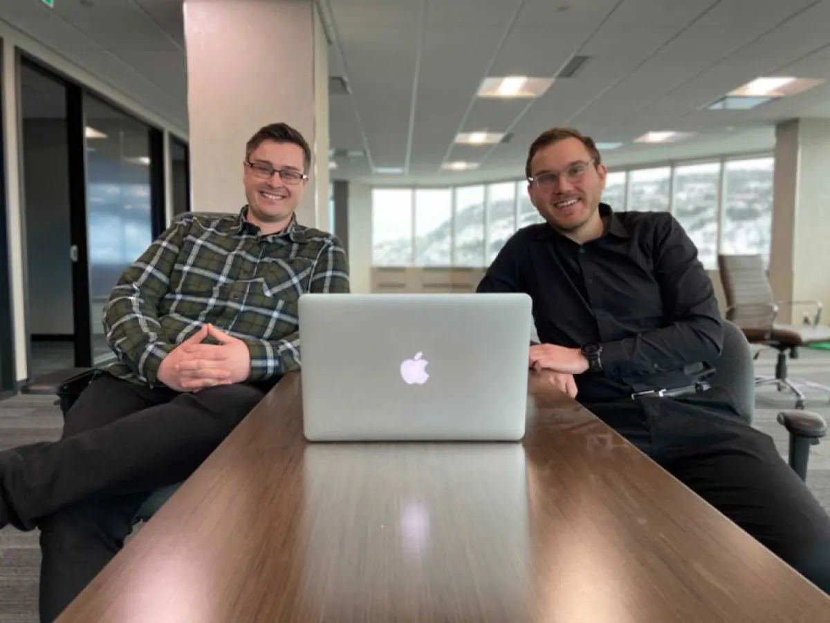 Two developers at a boardroom table at PolyUnity in St. John's